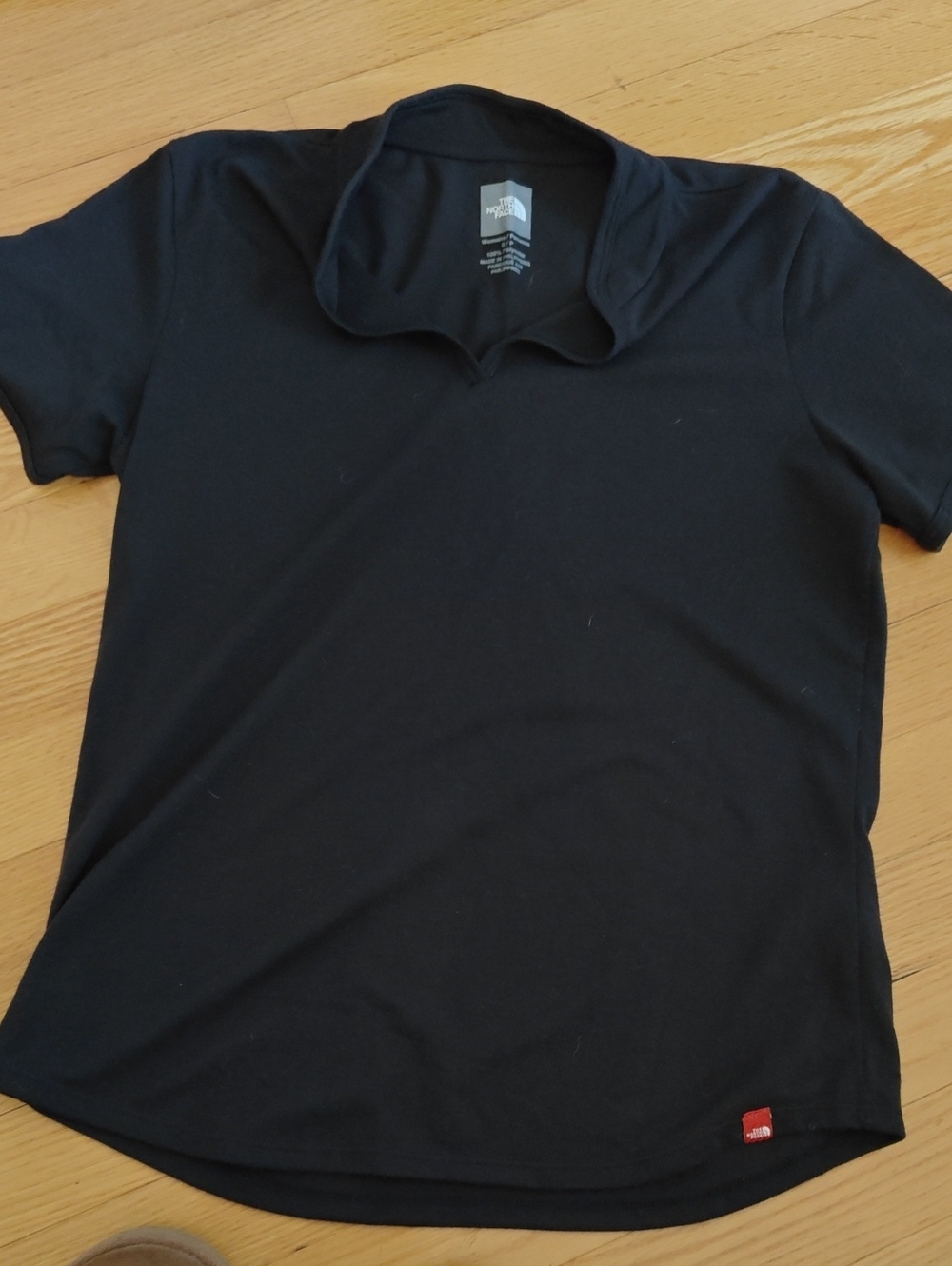 The North Face Black Short Sleeve Polo Shirt with Red Logo Tab